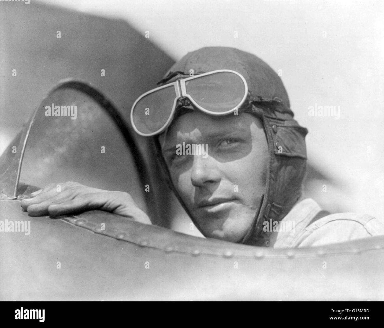 Lindbergh, wearing helmet with goggles up, in open cockpit of airplane at Lambert Field, St. Louis, Missouri. Circa 1923-28. Charles Augustus Lindbergh (February 4, 1902 - August 26, 1974) was an American aviator. Lindbergh gained world fame as the result Stock Photo