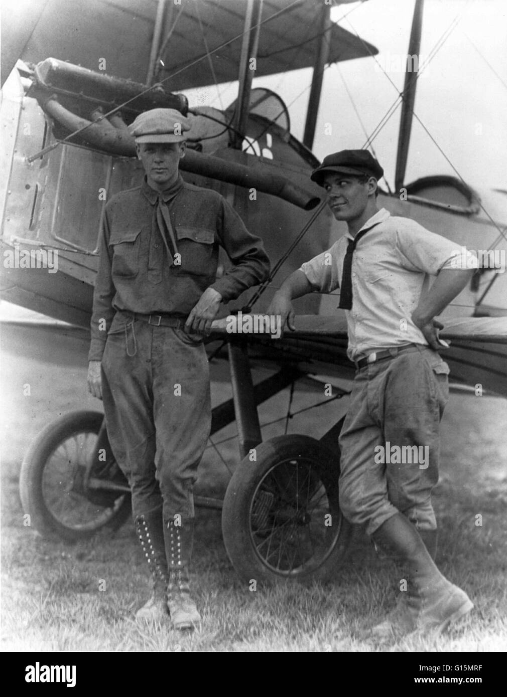 Lindbergh and Harlan 'Bud' Gurney standing by plane at Lambert Field, St. Louis, Missouri. Circa 1923-28. Charles Augustus Lindbergh (February 4, 1902 - August 26, 1974) was an American aviator. Lindbergh gained world fame as the result of his solo non-st Stock Photo