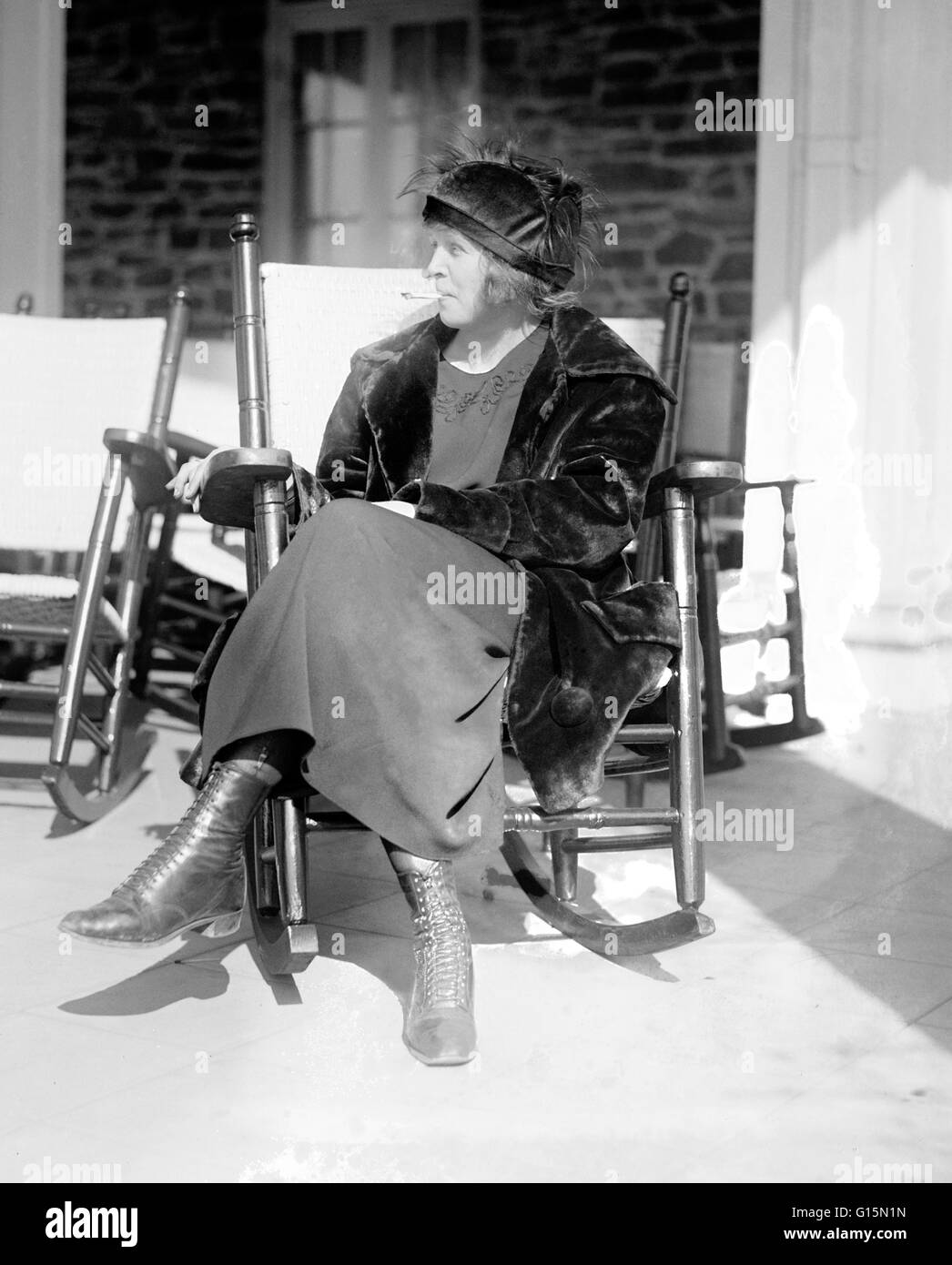 Local suffragettes are taking up in earnest the fight to obtain equal smoking rights for men and women in public places. Even the famous Capitol dining room has not escaped the fumes of the ladies cigarettes. Photo shows Miss Sarah Anderson, a Washington Stock Photo