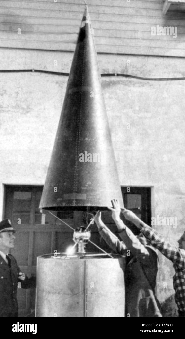 US 'Baby Satellite' with mock-up of a nose cone lowered over it in Washington for the ground test of its tiny transmitters.  This was a six-inch satellite, a type that was scheduled for test flights before the 20-inch Vanguard was launched.  Windows on th Stock Photo