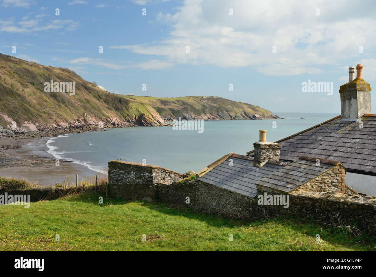 Former coastguard cottages at Man Sands, a secluded bay on the South Devon coast. Stock Photo