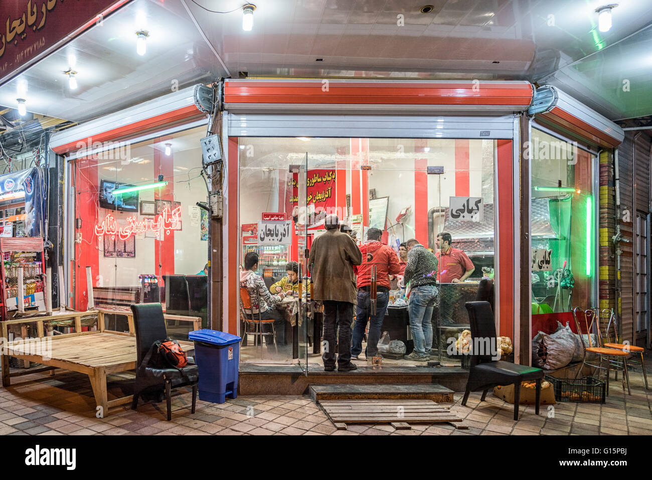 Small kebab restaurant with platform tables in Hamadan, Iran. Stock Photo