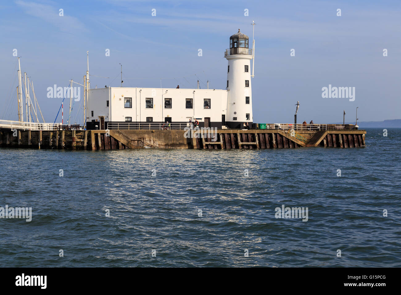 Scarborough lighthouse viewed from the harbour. Stock Photo