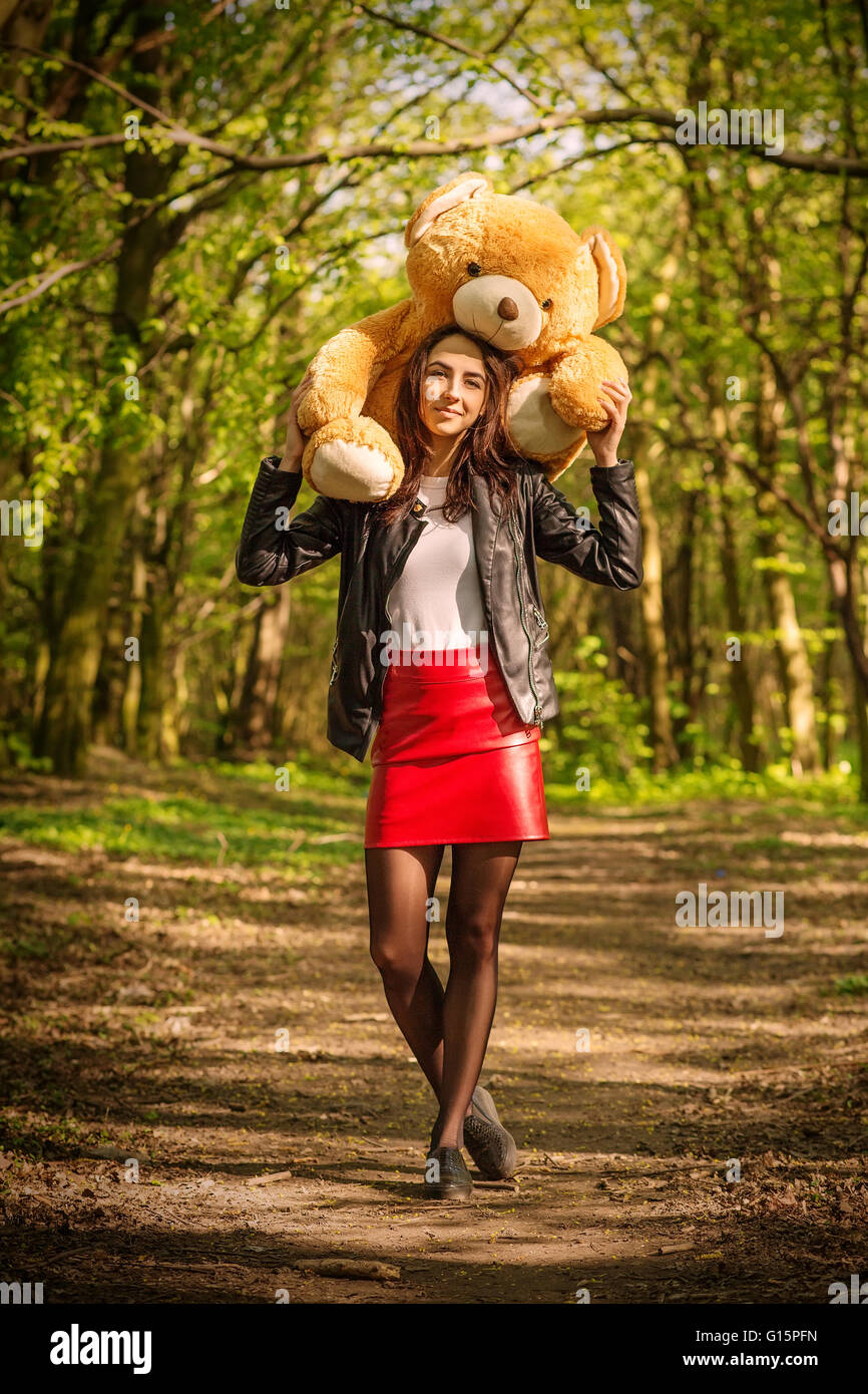 girl with teddy bear in old forest Stock Photo - Alamy