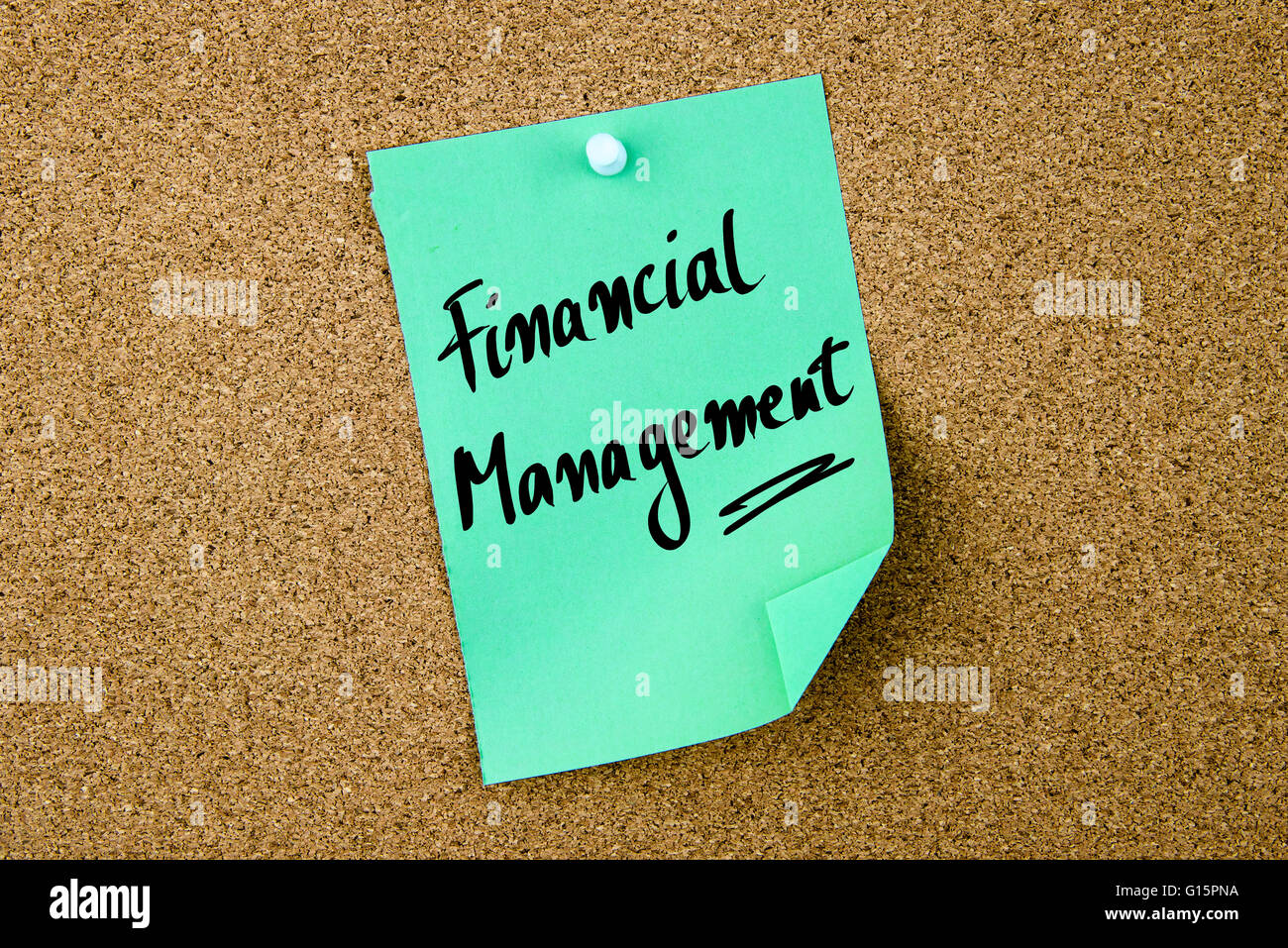 Financial Management written on green paper note pinned on cork board with white thumbtacks, copy space available Stock Photo