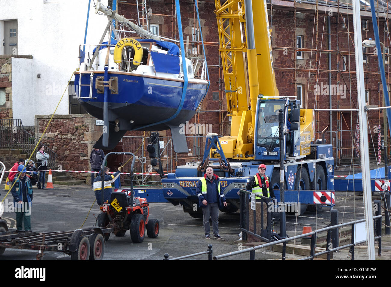 Mobile Crane lifting yacht into harbour, North Berwick Stock Photo Alamy