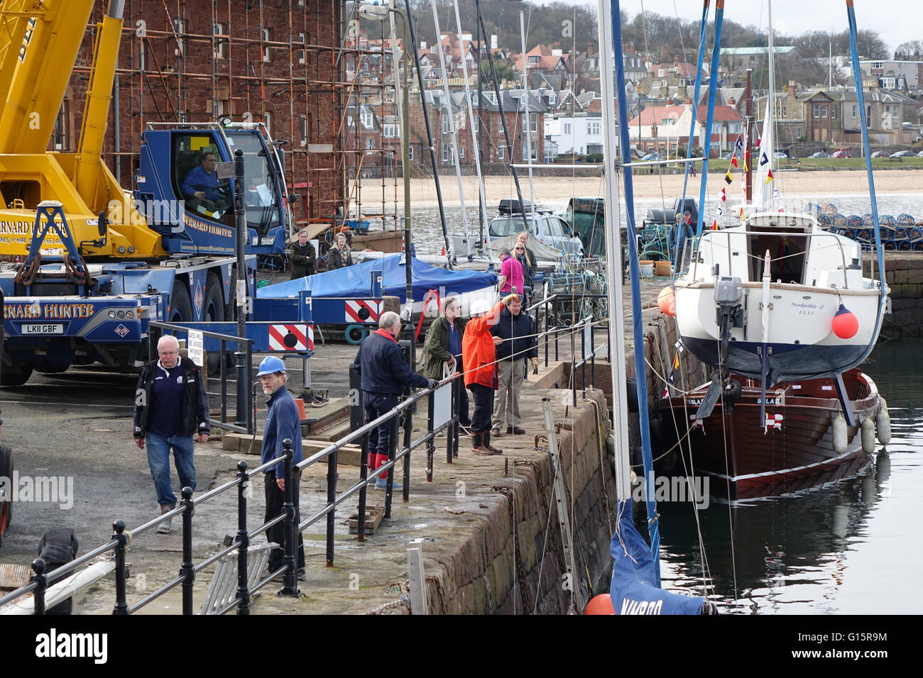 Mobile Crane lifting yacht into harbour, North Berwick Stock Photo Alamy