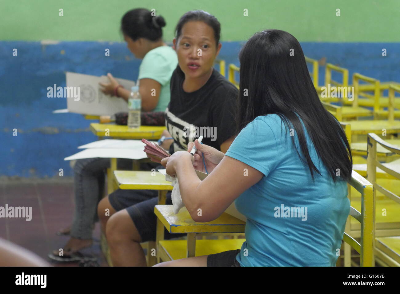 Mandaluyong, Philippines. 09th May, 2016. Ladies in discussion before casting their votes. © George Buid/Pacific Press/Alamy Live News Stock Photo