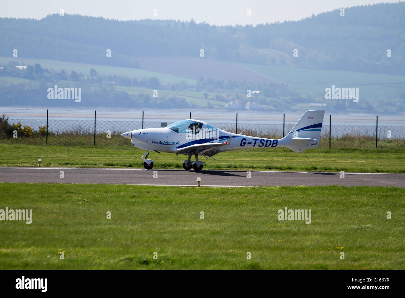 Dundee, Tayside, Scotland, UK, May 10th 2016. UK Weather: Warm sunny morning with a cool easterly breeze creating a thin haze across Dundee. Pilots from the Tayside Aviation landing their aircraft at the Dundee Airport. Credit: Dundee Photographics / Alamy Live News Stock Photo