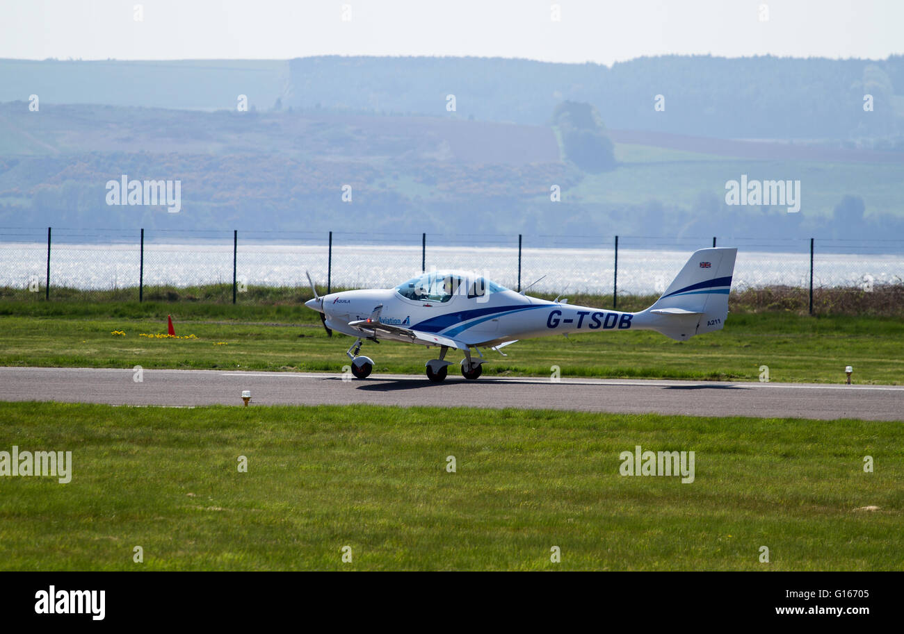 Dundee, Tayside, Scotland, UK, May 10th 2016. UK Weather: Warm sunny morning with a cool easterly breeze creating a thin haze across Dundee. Pilots from the Tayside Aviation landing their aircraft at the Dundee Airport. Credit: Dundee Photographics / Alamy Live News Stock Photo