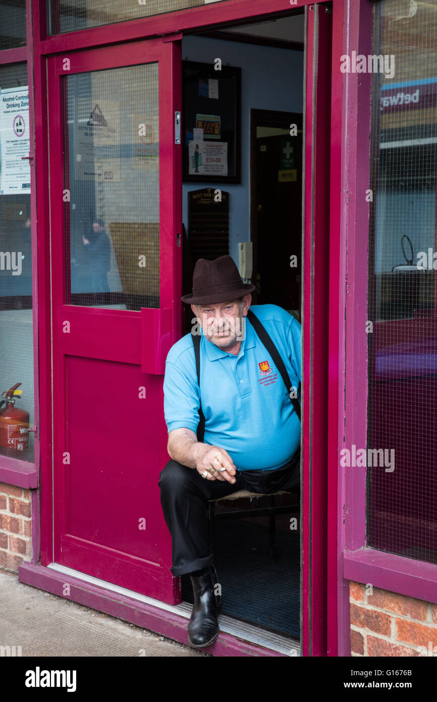 London, UK. 10th May, 2016. A West Ham fan pauses for a cigarette outside the Supporters' Club on the morning of West Ham's final match at the Boleyn ground. Credit:  Mark Kerrison/Alamy Live News Stock Photo
