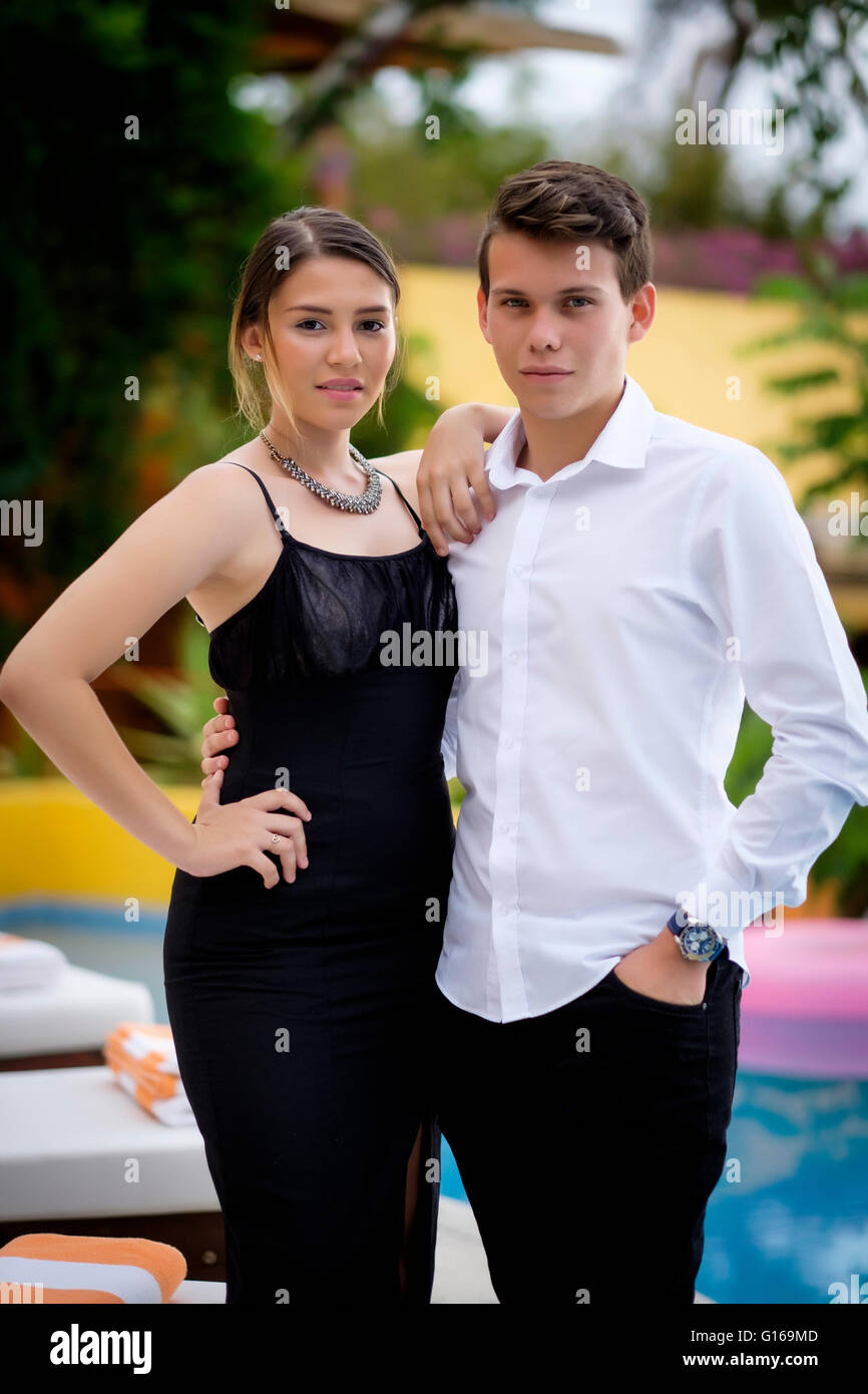 Portrait of male and female teenager in elegant party attire Stock Photo