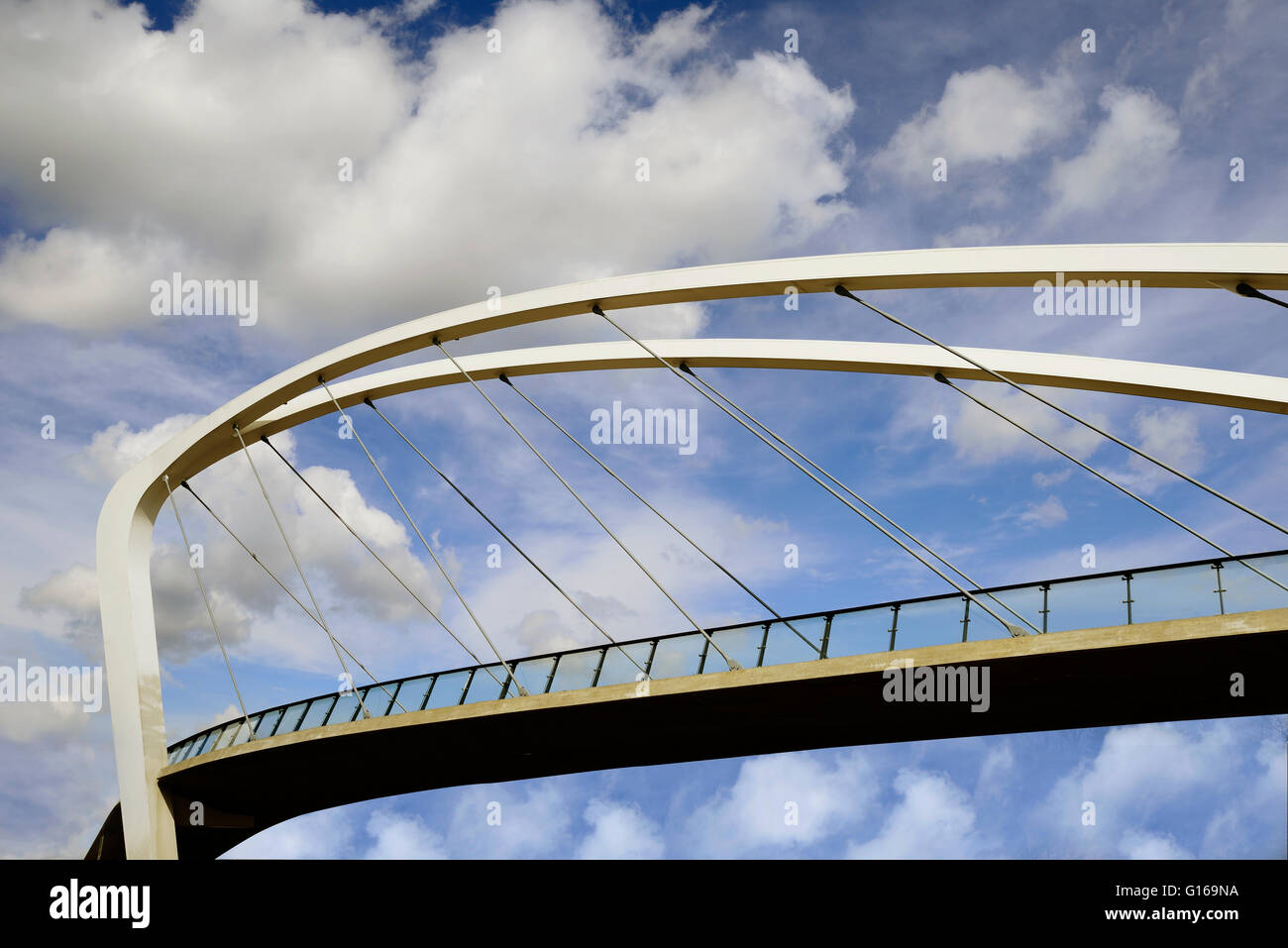 pedestrian bridge against the sky with clouds Stock Photo - Alamy