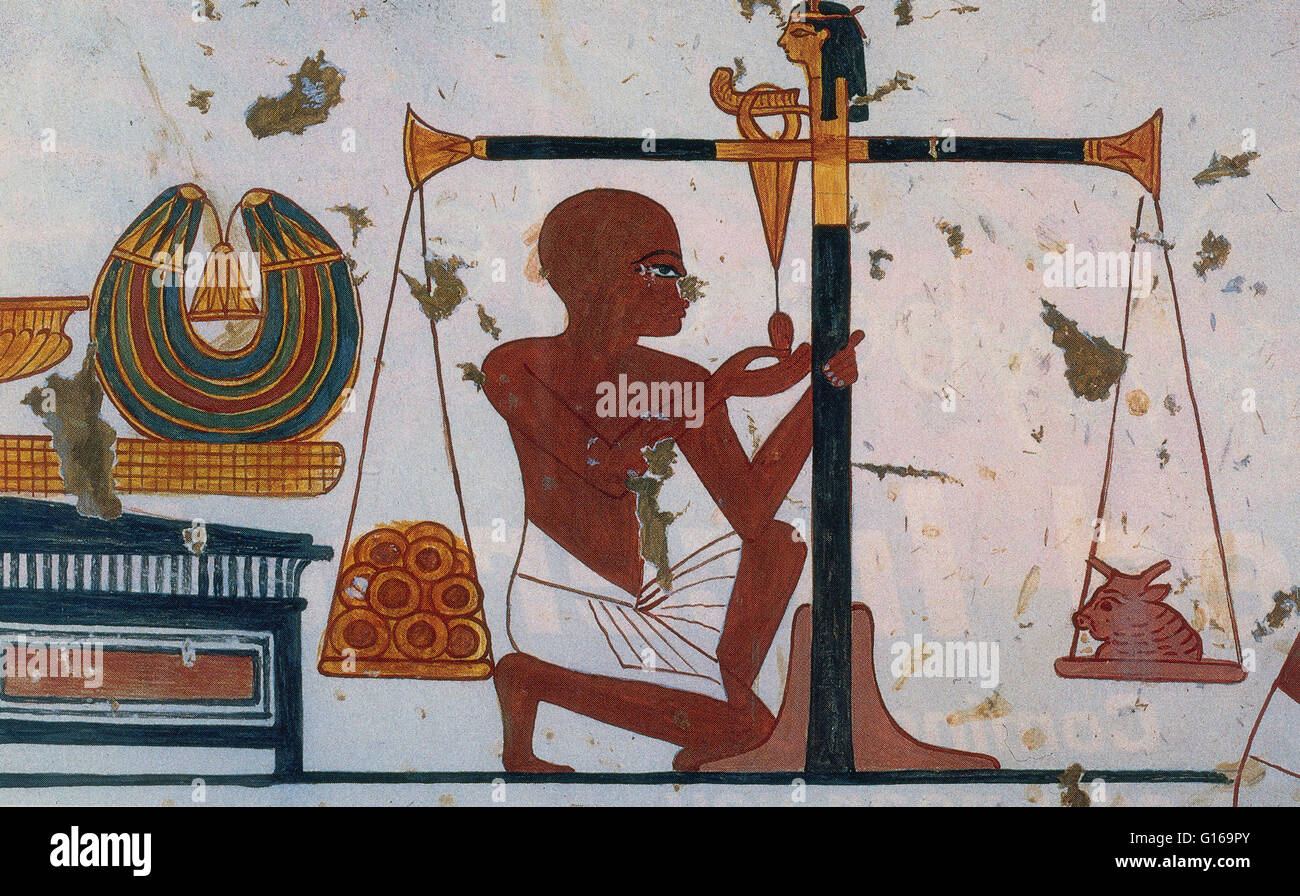 Ancient Egyptian gold rings being weighed. Wall painting from tomb at