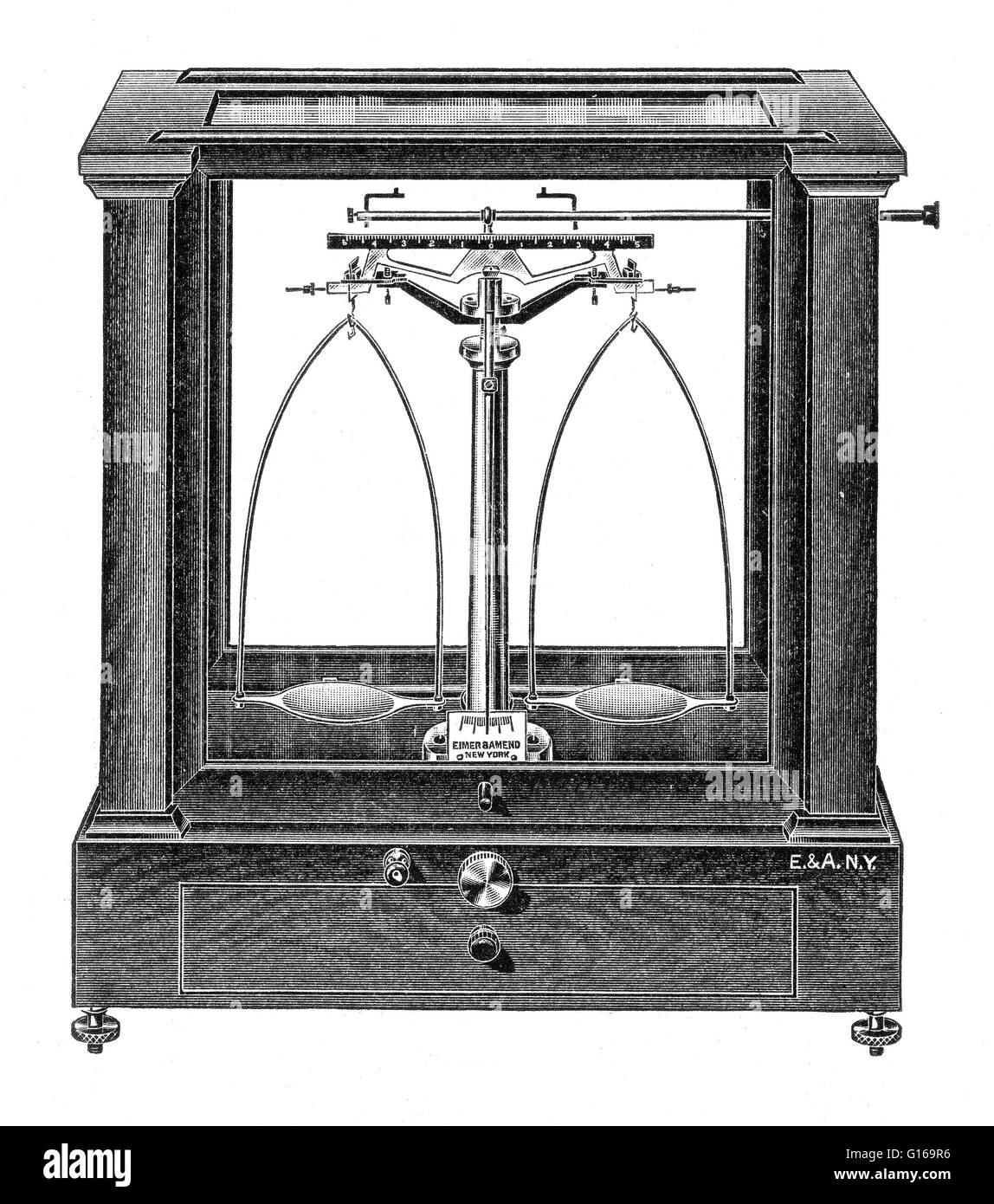 An analytical balance is a class of precision balance designed to measure small mass in the sub-milligram range (sensitivity of 0.1 milligram). The measuring pan of an analytical balance is inside a transparent enclosure with doors so that dust does not c Stock Photo