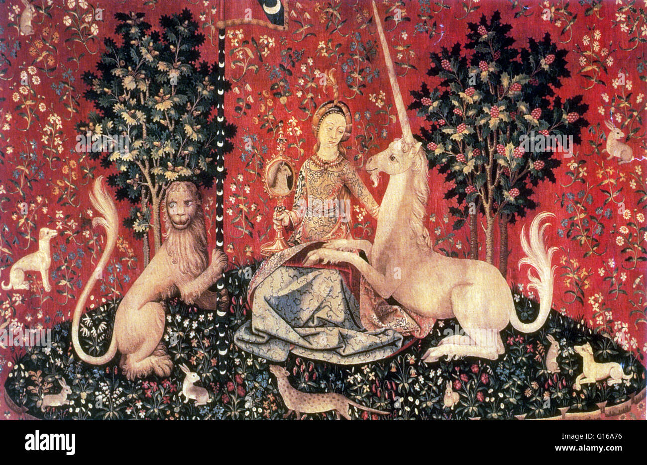The Lady and the Unicorn is the modern title given to a series of six tapestries woven in Flanders of wool and silk, from designs drawn in Paris in the late fifteenth century and are considered one of the greatest works of art of the Middle Ages in Europe Stock Photo