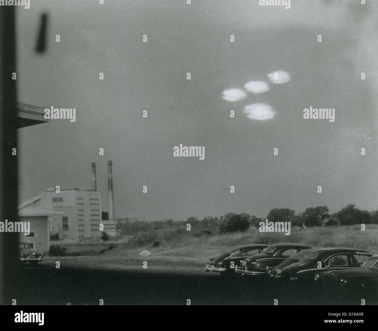 On July 16, 1952 at 09:35 AM Coast Guard seaman Shell Alpert, took this picture of four roughly elliptical blobs of light in formation through the window of his photographic laboratory. The objects were also witnessed by Coastguardsman Thomas Flaherty. Bo Stock Photo