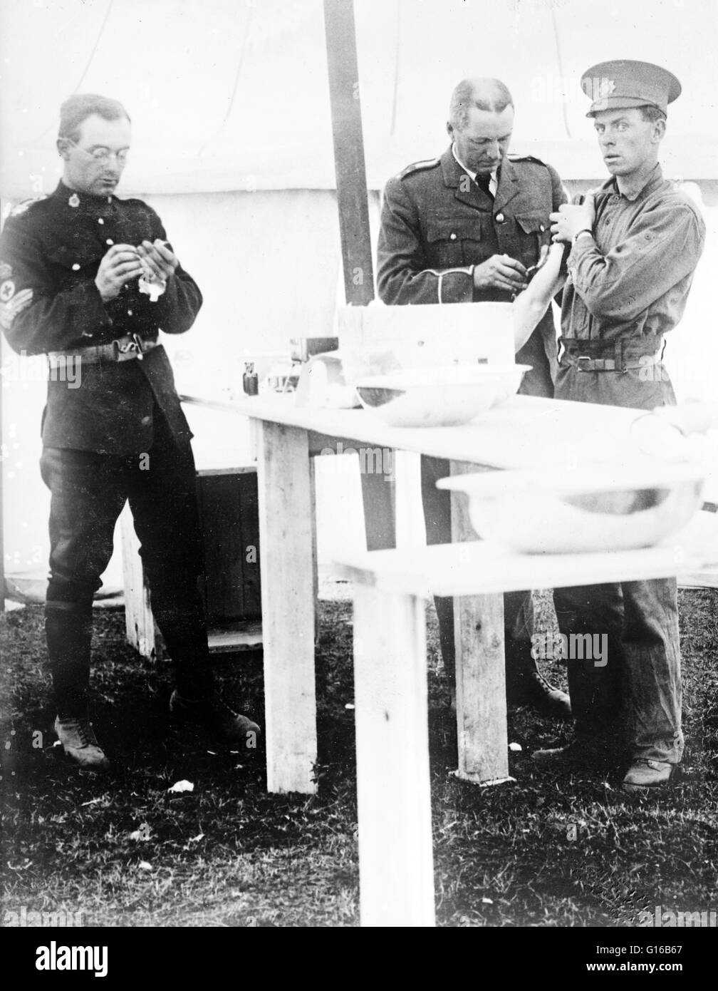 Canadian soldier being vaccinated at Canadian Forces Base Valcartier, Saint-Gabriel-de-Valcartier, Quebec. The camp was established in August 1914 as part of the mobilization of the Canadian Expeditionary Force at the beginning of World War I. Typhoid was Stock Photo