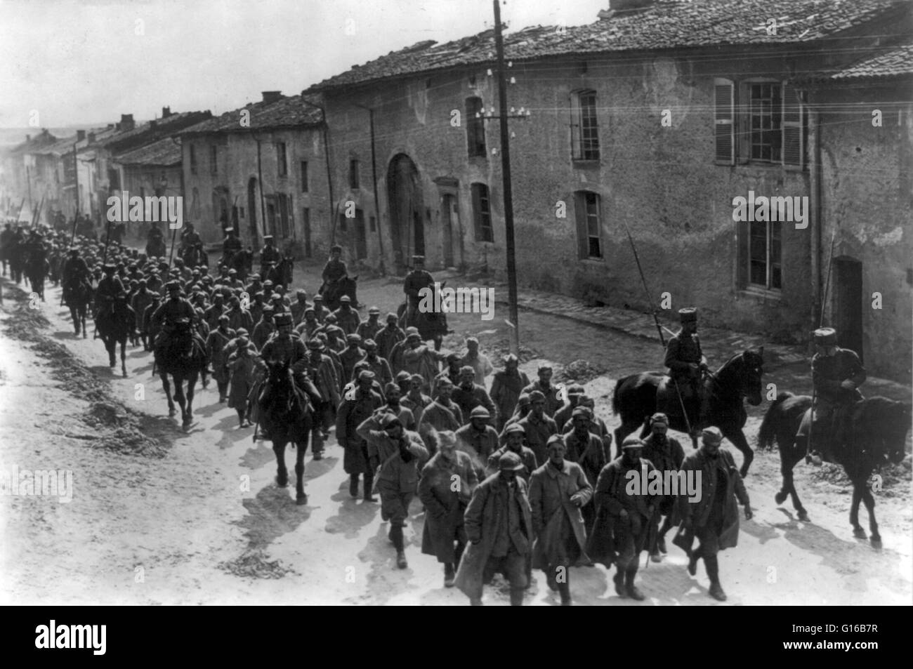 Bringing in French prisoners in a suburb of Verdun, France, 1916. Verdun was the site of a major battle of the First World War. One of the costliest battles of the war, Verdun exemplified the policy of a 'war of attrition' pursued by both sides, which led Stock Photo