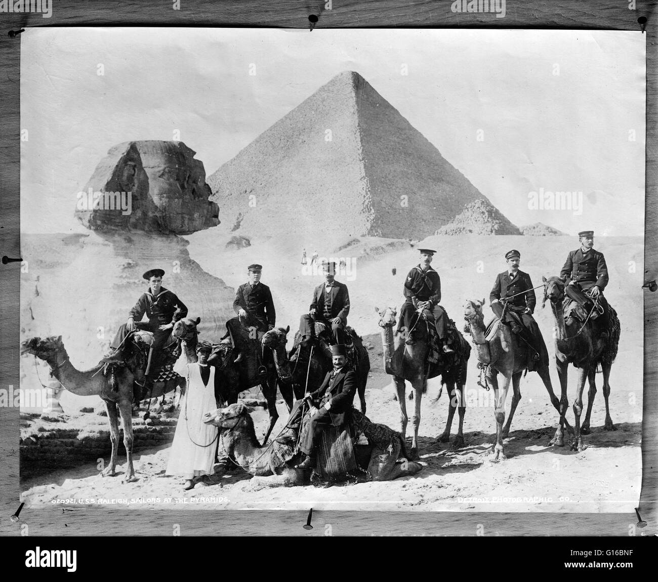 Entitled: 'U.S.S. Raleigh, sailors at the pyramids'. Photographed by the Detroit Publishing Company, circa 1897-1900. USS Raleigh (C-8) was a United States Navy protected cruiser commissioned in 1894 and in periodic service until 1919. In 1897 she reporte Stock Photo