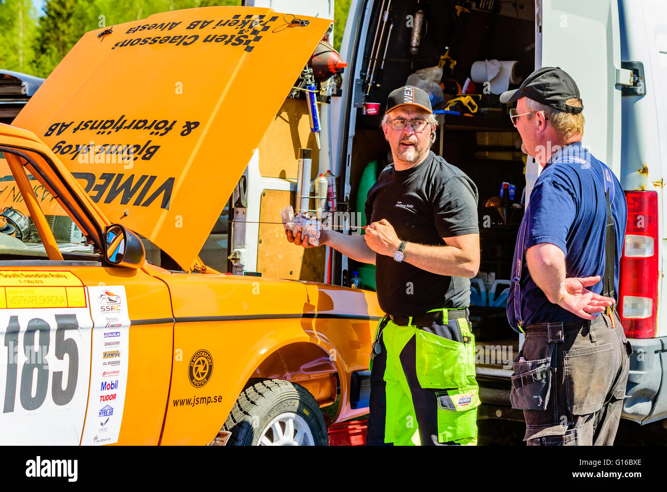 Emmaboda, Sweden - May 7, 2016: 41st South Swedish Rally in service depot. Team Claesson-Bergstrand orange Volvo 142 in depot, h Stock Photo