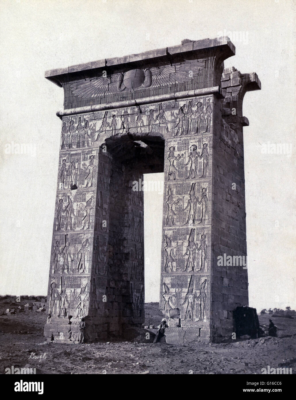 North side view of a pylon adorned with bas-reliefs, Thebes, photographed by Maison Bonfils, circa 1867-1885. The Temple of Khonsu located within the large Precinct of Amun-Re at Karnak is an example of an almost complete New Kingdom temple, and was origi Stock Photo