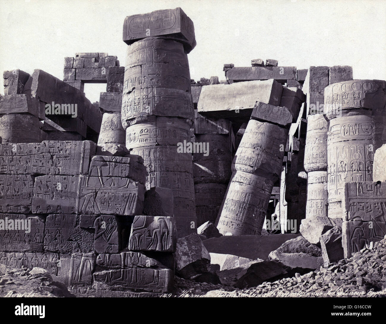 Interior view of the remains of a hypostyle hall, Thebes, photographed by Maison Bonfils, circa 1867-1885. The Karnak Temple Complex comprises a vast mix of decayed temples, chapels, pylons, and other buildings. Building at the complex began during the re Stock Photo