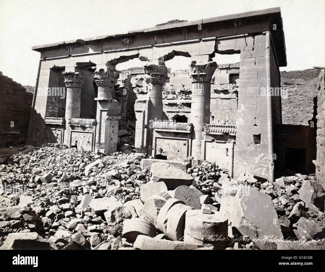 Rubble and ruin outside of portico of what was the Temple of Mandulis, a Nubian god, photographed by Maison Bonfils, circa 1867-1885. The Temple of Kalabsha is an Ancient Egyptian temple that was originally located at Bab al-Kalabsha (Gate of Kalabsha), a Stock Photo