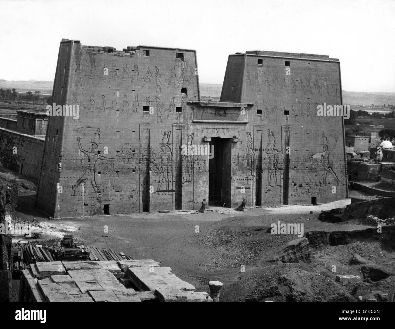 Entitled: 'Temple of Horus. Edfu, Egypt' photographed by American Colony Jerusalem circa 1900-1920. The Temple of Edfu is an ancient Egyptian temple located on the west bank of the Nile in the city of Edfu which was known in Greco-Roman times as Apollonop Stock Photo