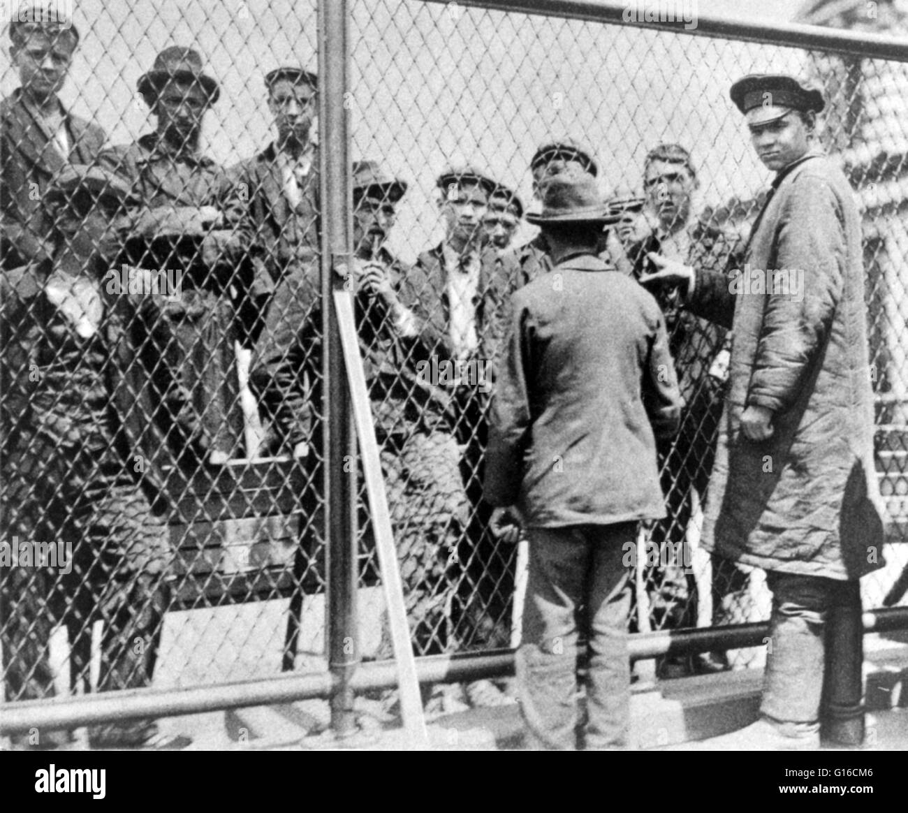 Entitled; "Detention pen on roof of main building where emigrants held for deportation may go in fine weather." In the 35 years before Ellis Island opened, over eight million immigrants arriving in New York had been processed by New York State officials a Stock Photo