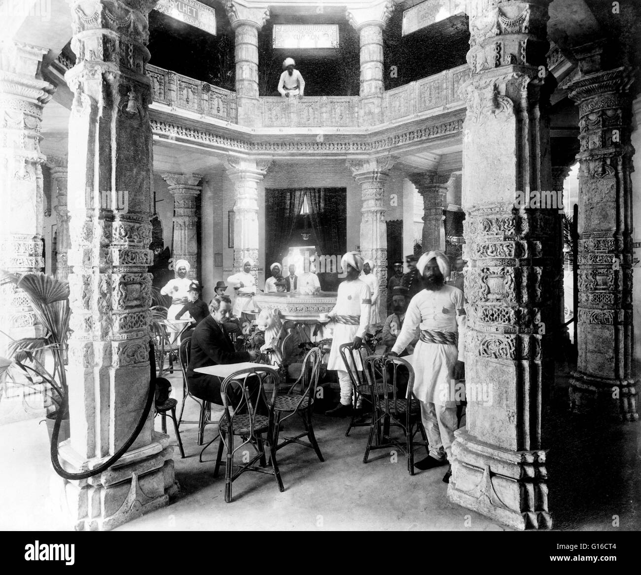 Café in the rotunda of the Pavilion of India, with waiters and patrons, Paris Exposition, 1889. The Exposition Universelle of 1889 was a World's Fair held in Paris, France from May 6 to October 31, 1889. It was held during the year of the 100th anniversar Stock Photo