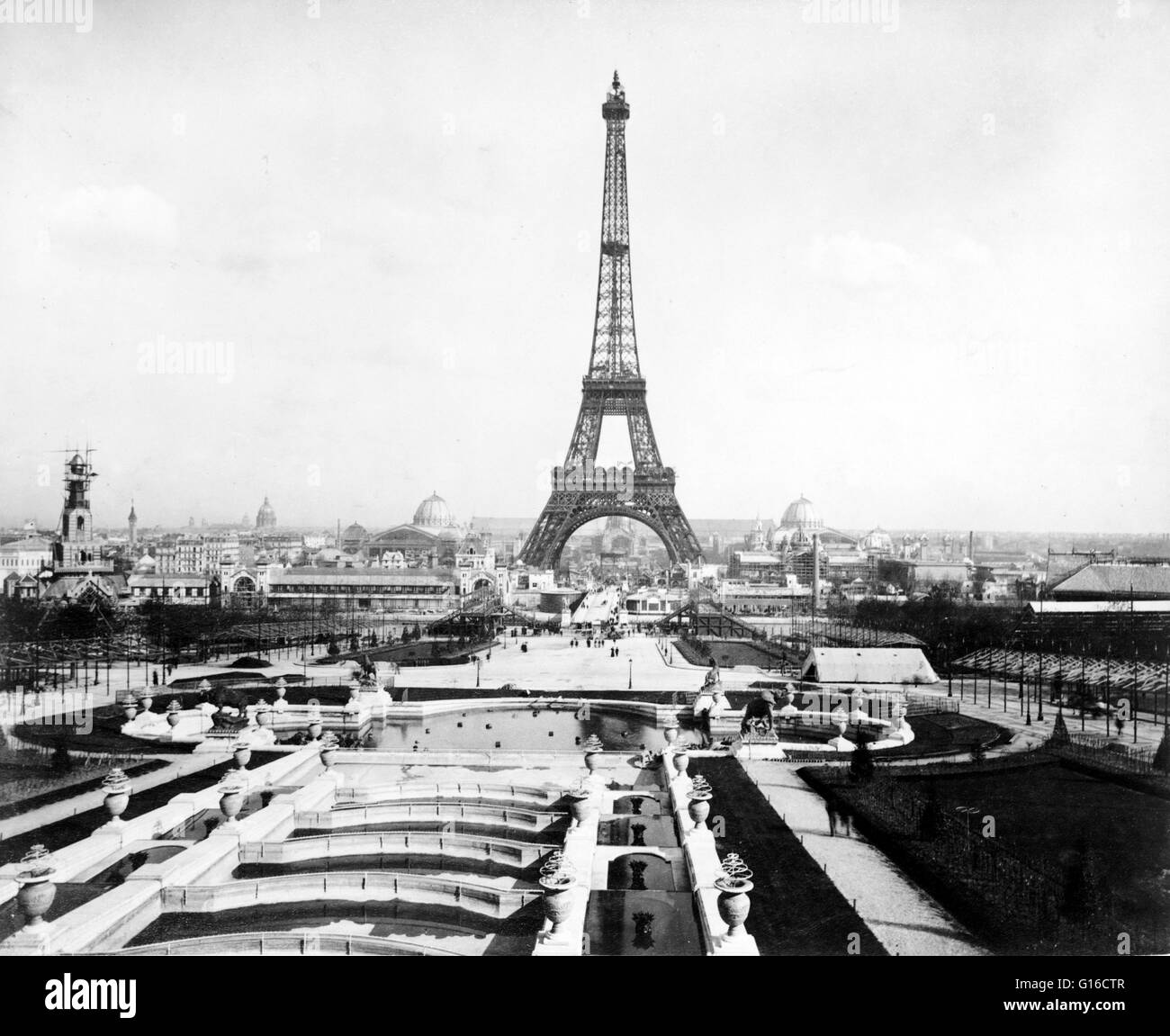 Eiffel Tower and exposition buildings on the Champ de Mars as seen from the Trocadéro Palace, Paris Exposition, 1889. The Eiffel Tower (La Tour Eiffel) is an iron lattice tower located on the Champ de Mars in Paris. It was named after the engineer Gustave Stock Photo