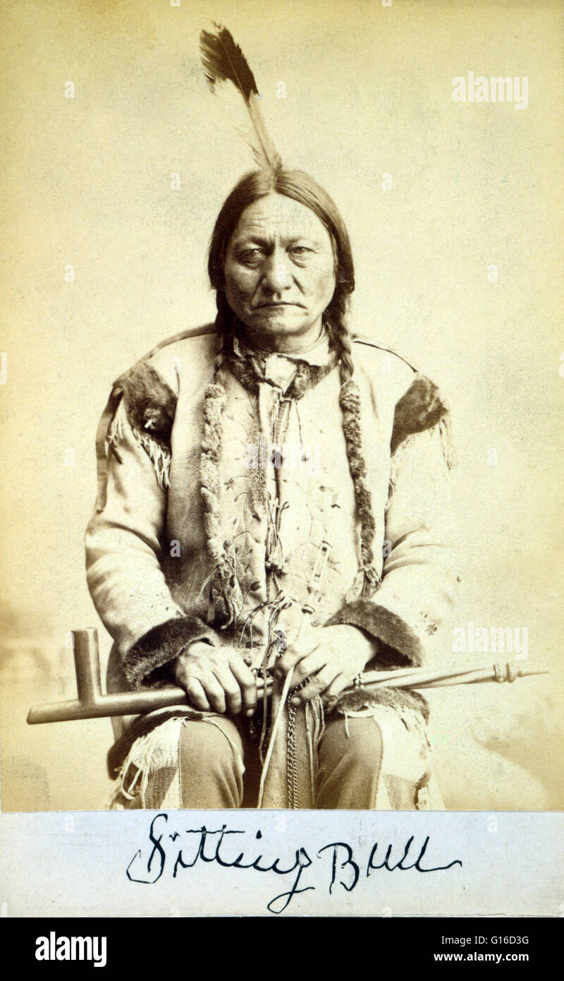 Sitting Bull, holding peace pipe, photographed and published by Palmquist & Jurgens, 1884. Sitting Bull (1831 - December 15, 1890) was a Hunkpapa Lakota holy man who led his people as a tribal chief during years of resistance to United States government p Stock Photo