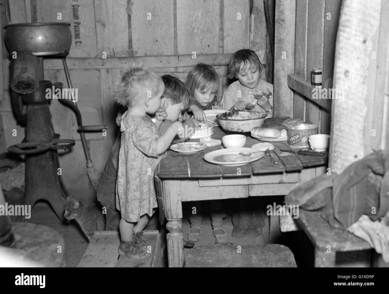 Entitled: 'Christmas dinner in home of Earl Pauley. Near Smithfield, Iowa. Dinner consisted of potatoes, cabbage and pie.' For most families during the Great Depression, Christmas was not a time for extravagance. Money and jobs were difficult to come by, Stock Photo