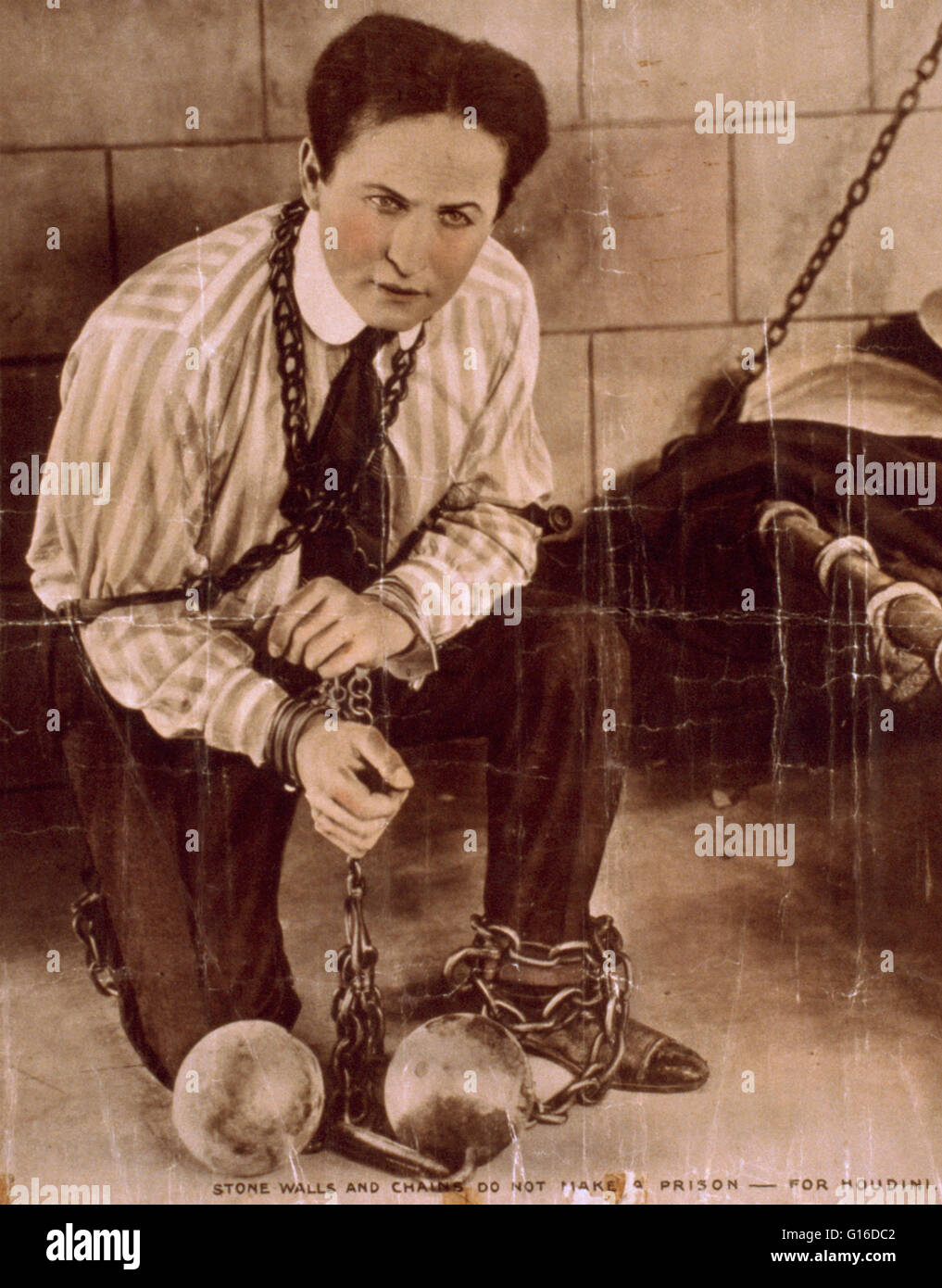 Entitled: 'Stone walls and chains do not make a prison for Houdini' created by 'Famous Players-Lasky Corporation', 1919. Houdini followed his performance in 'The Master Mystery' with the 'Grim Game,' the first of two films that he made for Famous Players. Stock Photo