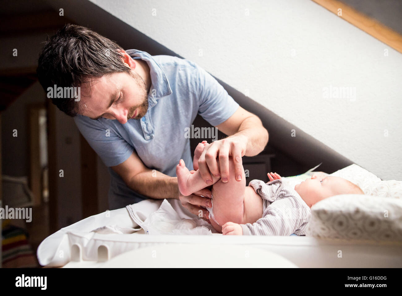Man Changing Baby Diaper Stock Photos & Man Changing Baby Diaper Stock