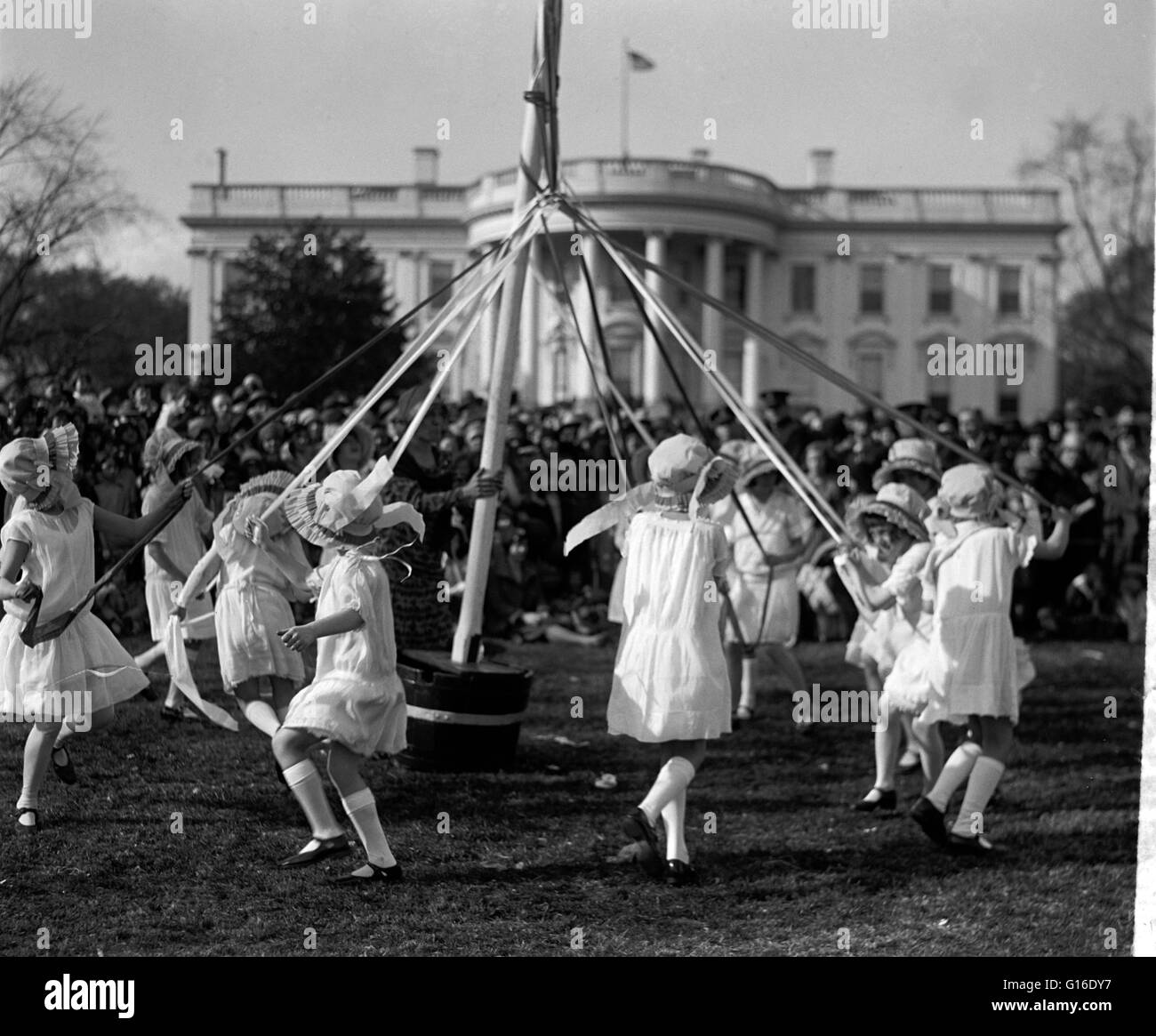 May Pole dance, at the Easter egg roll event sponsored by the White House. Maypole dancing is a form of folk dance from Germany, England, and Sweden. There are two forms. The first and most popular consists of dancers that perform circle dances around a t Stock Photo