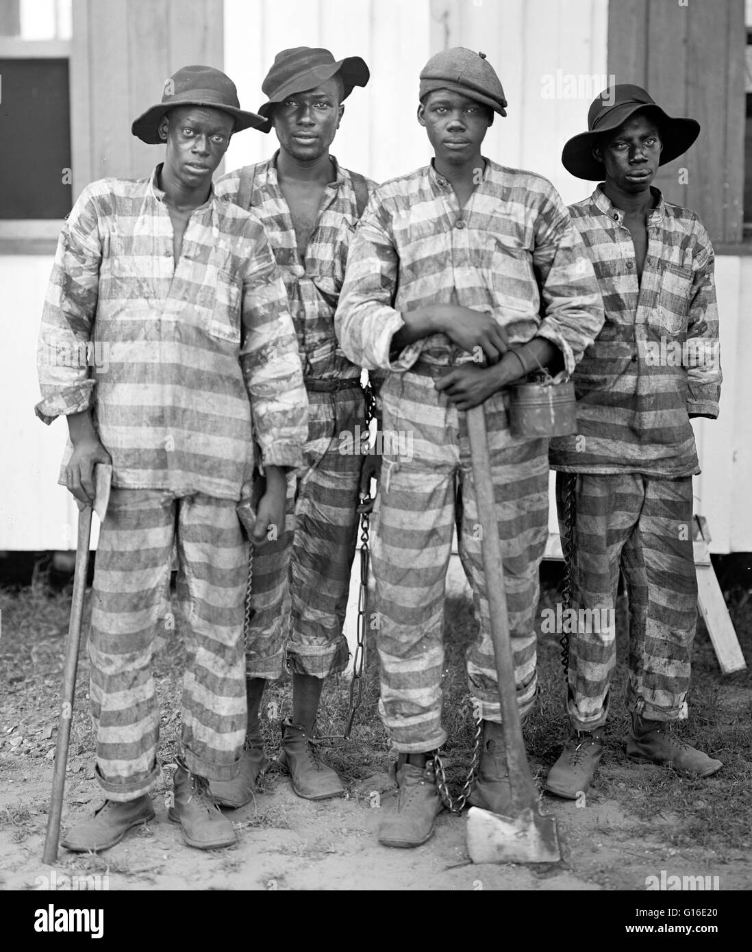 Entitled: 'A Southern chain gang.' Two ankle shackles attached to each other by a short length of chain are known as a hobble or as leg irons. These could be chained to a much longer chain with several other prisoners, creating a work crew known as a chai Stock Photo
