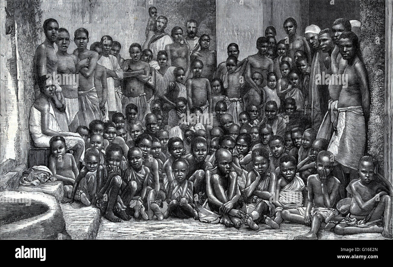 Entitled: 'The African slave trade - slaves taken from a dhow captured by H.M.S. Undine' shows African men, women and many children. In the background, two British sailors, 1884.' The Atlantic slave trade took place across the Atlantic Ocean from the 16th Stock Photo