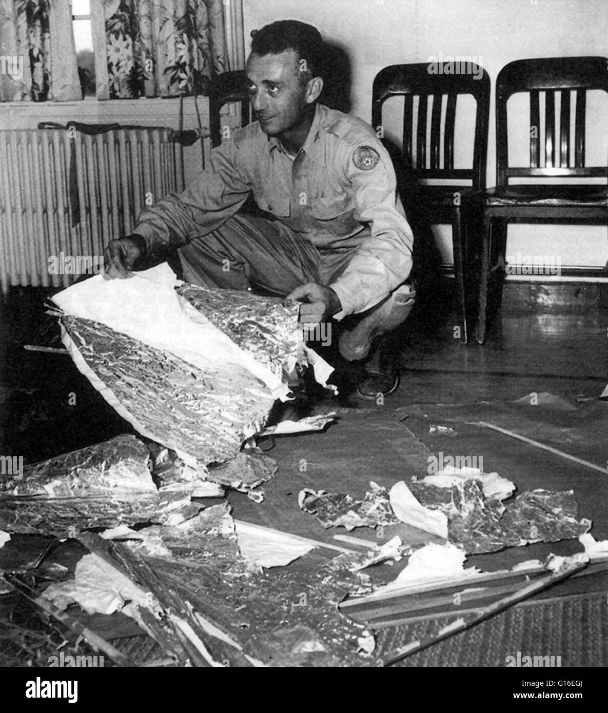 Major Jesse Marcel at Fort Worth, Texas with balloon debris. This photo of Marcel with weather balloon material was widely published, but supposedly he would later admit the material he picked up at Brazel's ranch was not part of any kind of weather ballo Stock Photo