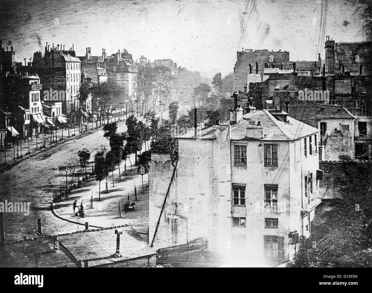 'Boulevard du Temple', taken by Daguerre in 1838 in Paris, includes the earliest known candid photograph of a person. The image shows a street, but because of the over ten-minute exposure time the moving traffic does not appear. At the lower left, however Stock Photo