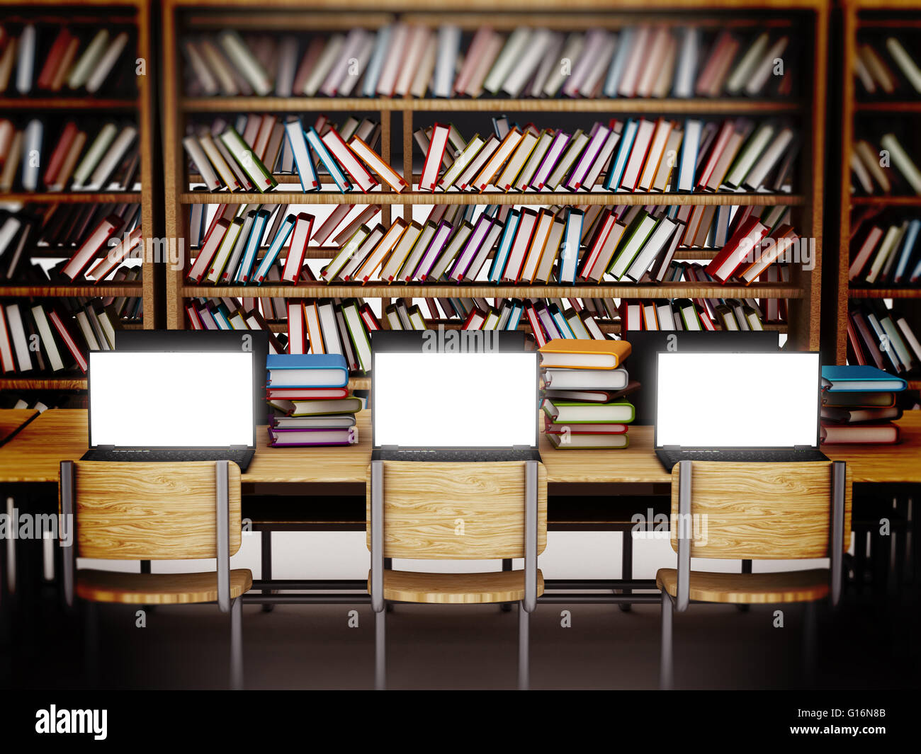 Laptop computers with blank screens standing on table inside a library ...