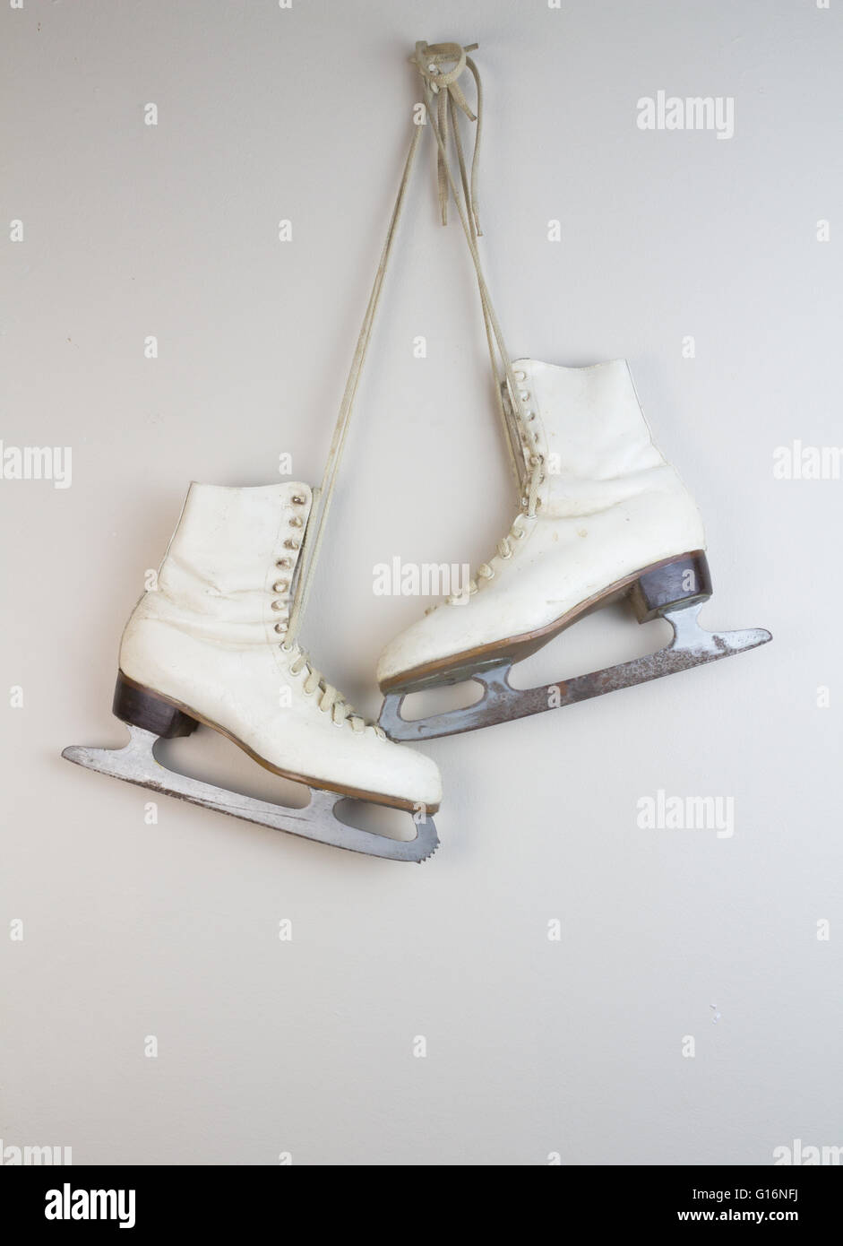 Old white ice skates hanging on the wall Stock Photo Alamy