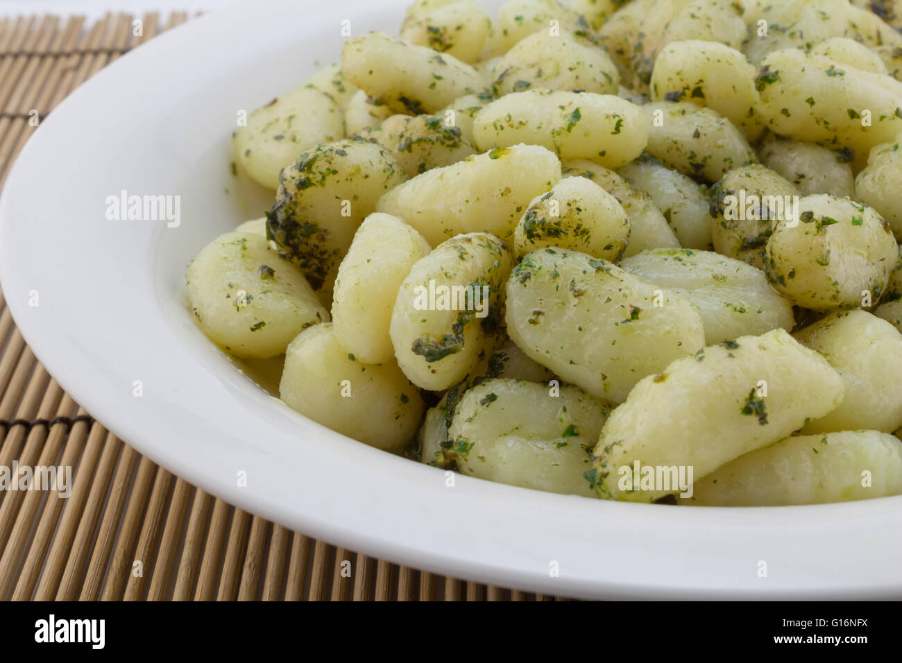 Gnocchi pasta close up with pesto Stock Photo Alamy