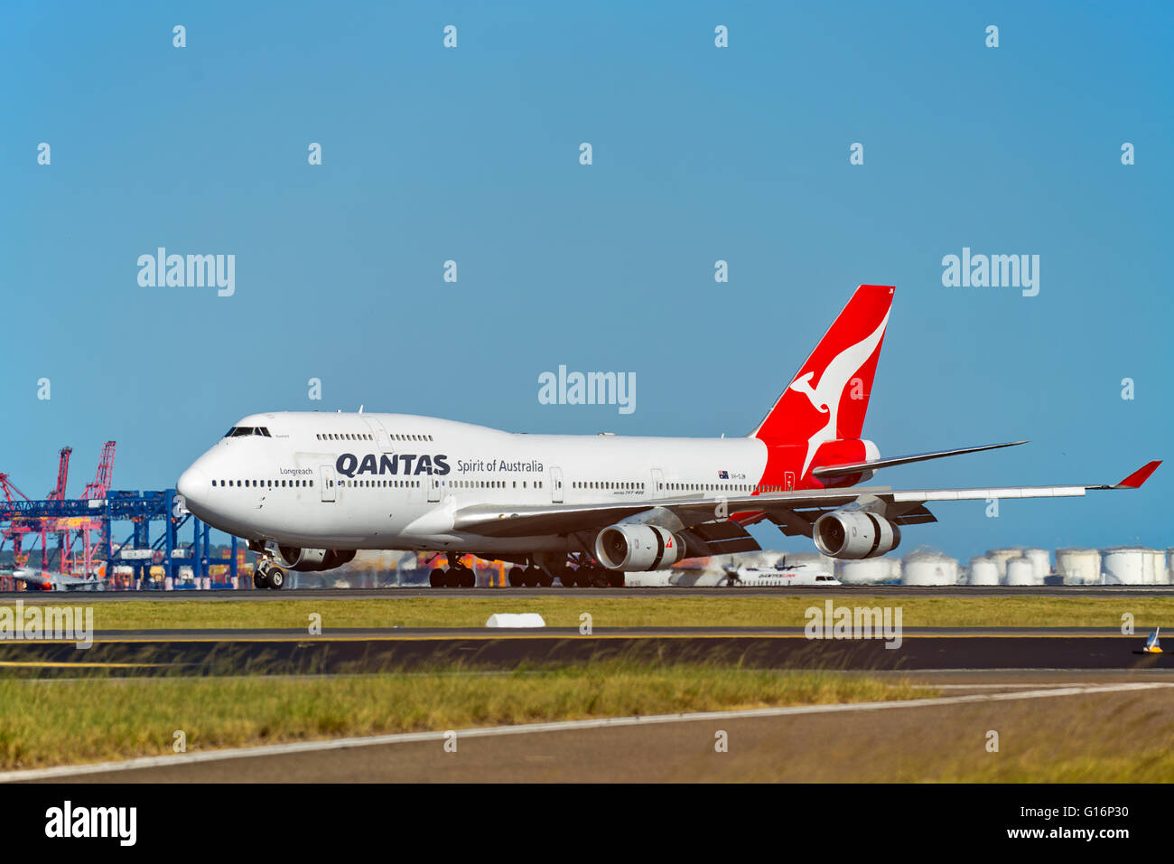 A QANTAS Boeing 747-400 lands in Sydney on an international flight. Stock Photo