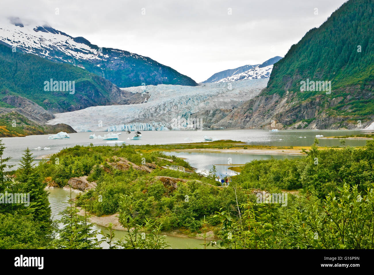 Mendenhall glacier, ice floes, and mountains near Juneau, AK.  It's about 12 miles (19 km) long and located in Mendenhall Valley Stock Photo