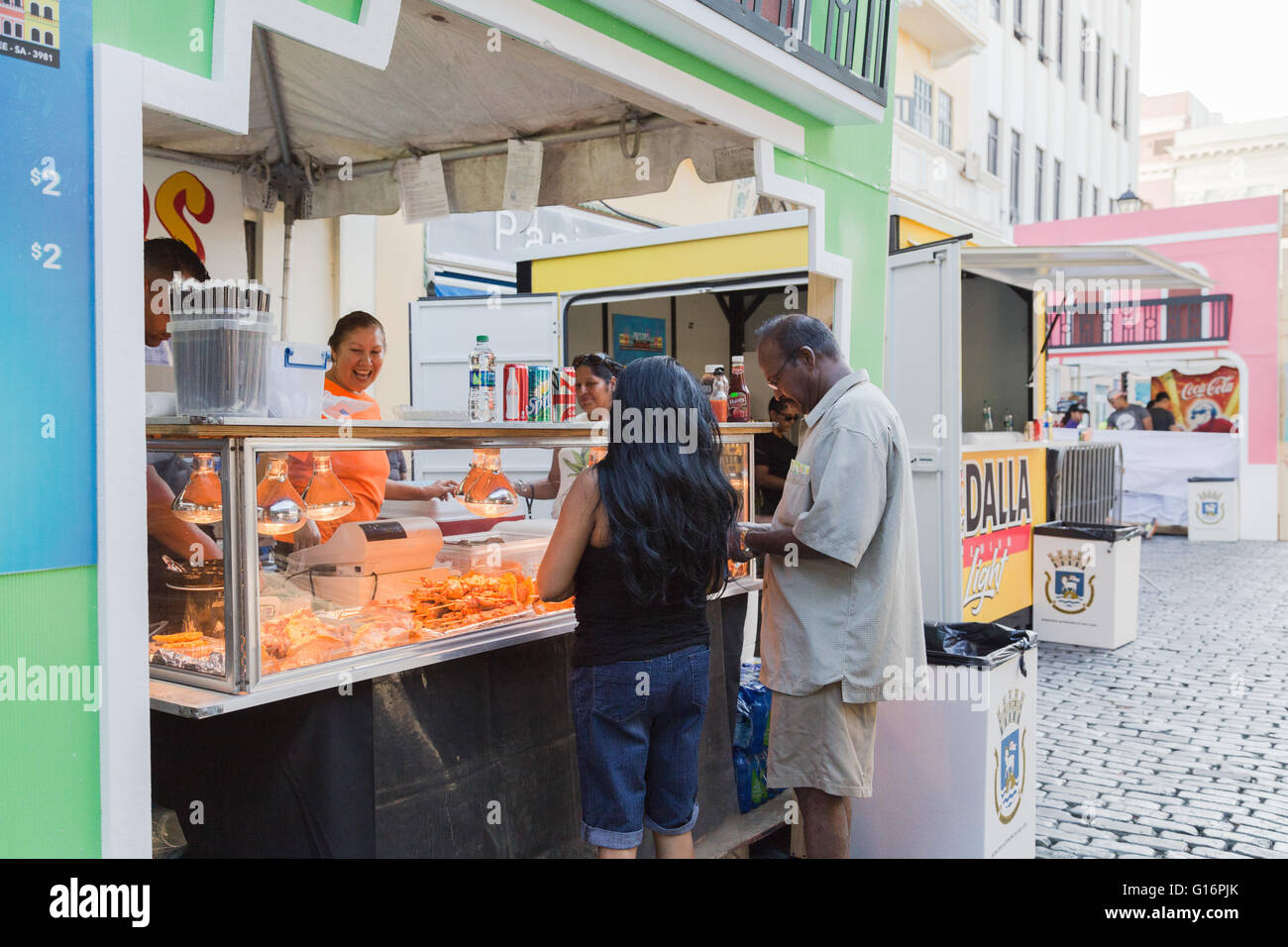 San Juan, PR. 14th January, 2016. Tourists look at typical Puerto Rican fried snacks at the San Sebastian Festival. Stock Photo