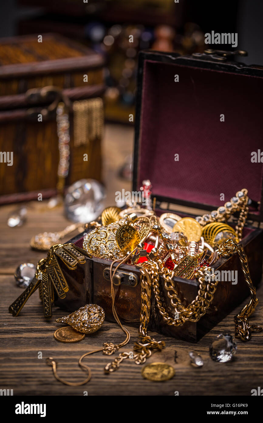 Open treasure chest full of jewellery Stock Photo