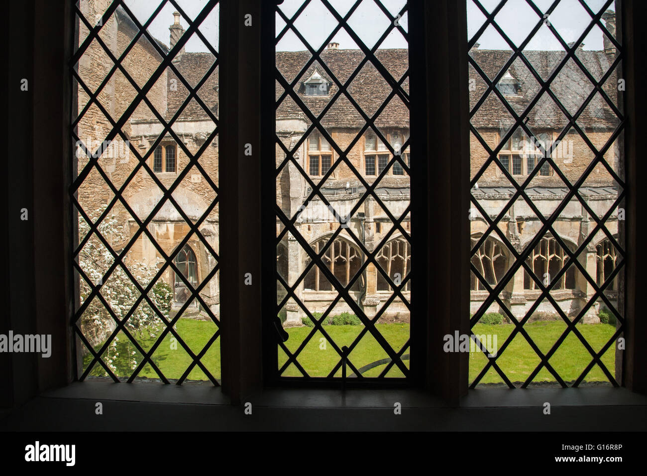 Lacock Abbey in Wiltshire through leaded windows Stock Photo