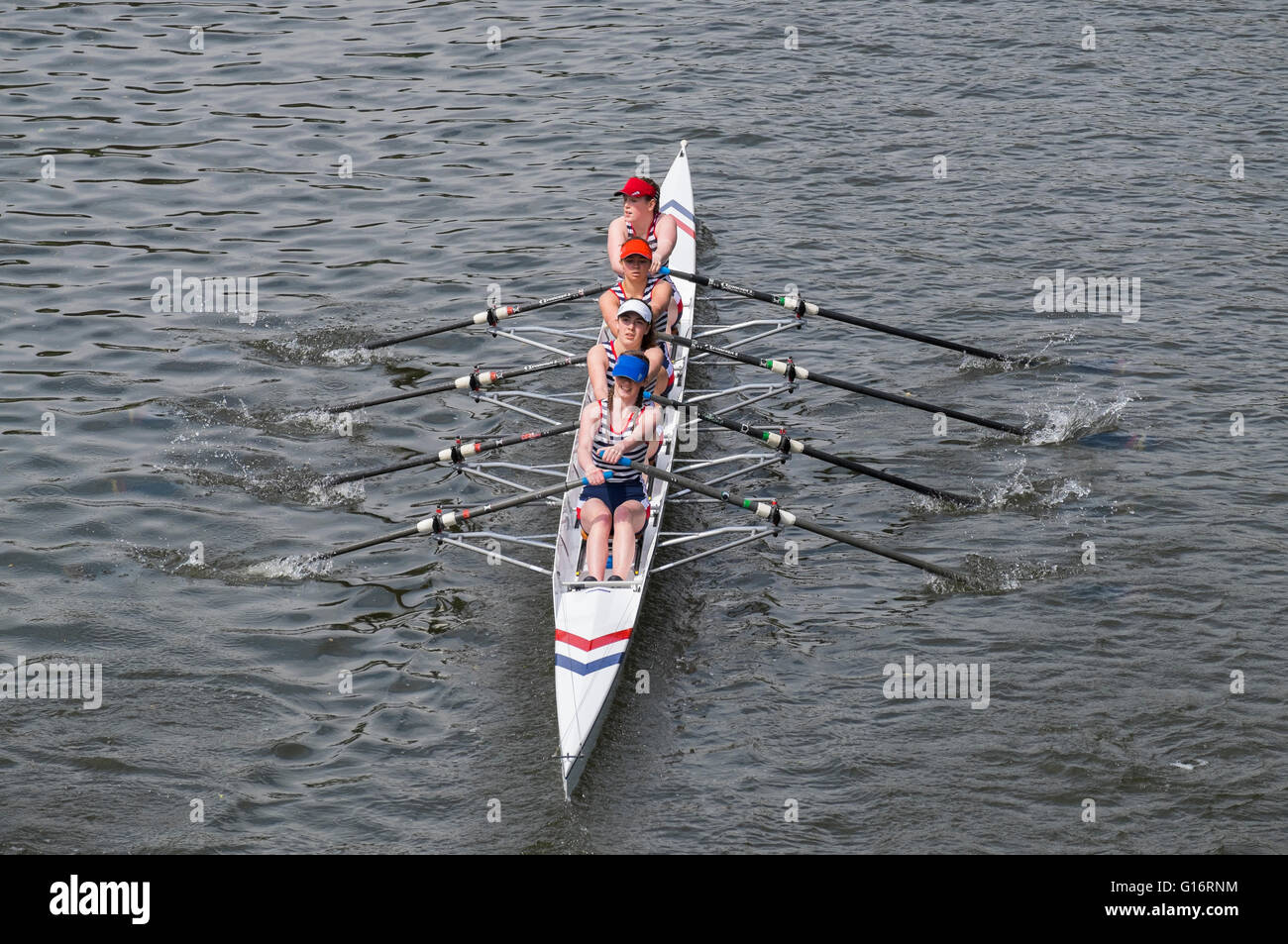 A female rowing team competing at Shrewsbury Regatta on the River